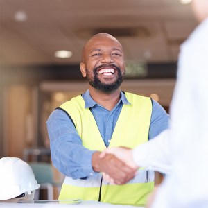 Handshake, architecture and engineer man partnership, real estate meeting or agreement at construct.